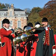 Hunters with hunting horns / bugles during the commemoration of Saint Hubert / Saint Hubertus, Brasschaat, Belgium