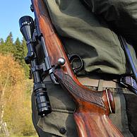 Hunter with shotgun and scope in the Ardennes, Belgium