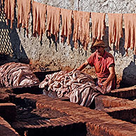 Tanner at work in outdoor tannery, Marrakech, Morocco