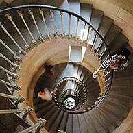 Tourist taking picture of spiral staircase inside the lighthouse Phare des Baleines on the island Ile de Ré, Charente-Maritime, France