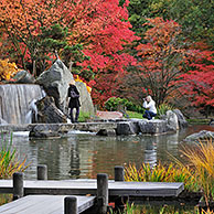 Tourists visiting Japanese garden in autumn at Hasselt, Belgium