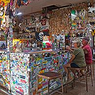 The historic Daly Waters Pub decorated with business cards, bras, banknotes and memorabilia from passing travellers along the Stuart Highway, Northern Territory, Australia