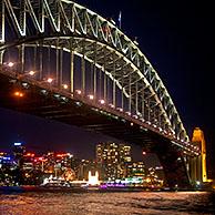 Sydney Harbour Bridge and view over the city skyline at night, New South Wales, Australia
