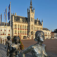The sculpture group The Runners and town hall at the Market Square in Sint-Niklaas, Belgium 