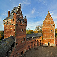 The medieval Beersel Castle reflected in moat, Belgium