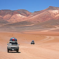 Four-wheel drive vehicles driving on dirt-track on the Altiplano in Bolivia