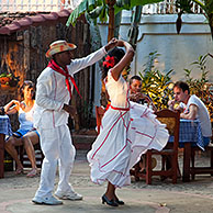 Cuban couple dancing Spanish style for tourists in an open air bar in Trinidad, Cuba