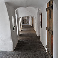 Arcade covered sidewalk pavement along the Laubengasse at Glorenza / Glurns, Dolomites, Italy