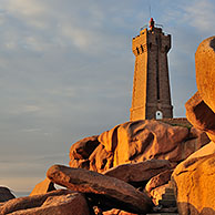 The Pors Kamor lighthouse at sunset along the Côte de granit rose / Pink Granite Coast at Ploumanac'h, Brittany, France