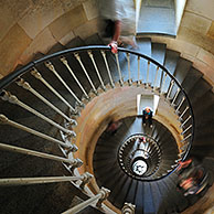 Tourists climbing spiral staircase inside the lighthouse Phare des Baleines on the island Ile de Ré, Charente-Maritime, France