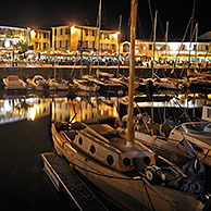 Sailing boats in the port at Saint-Martin-de-Ré at night on the island Ile de Ré, Charente-Maritime, France