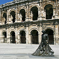 Statue of matador and ancient Roman amphitheatre, Nimes, France