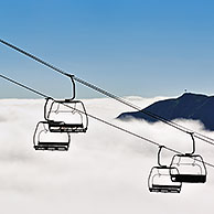 Empty chairlift in the mist at sunrise along the Col du Tourmalet in the Pyrenees, France