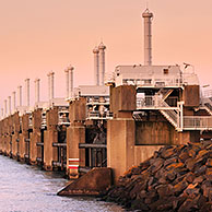 Storm flood barrier / Oosterscheldekering / Eastern Scheldt storm surge barrier at Neeltje Jans, part of the Delta Works that regulates the enormous tidal flows and harnesses spring floods in the Netherlands